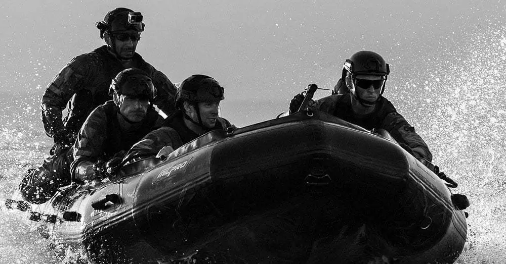 Earthrace crew training a local government team on the Zodiac.