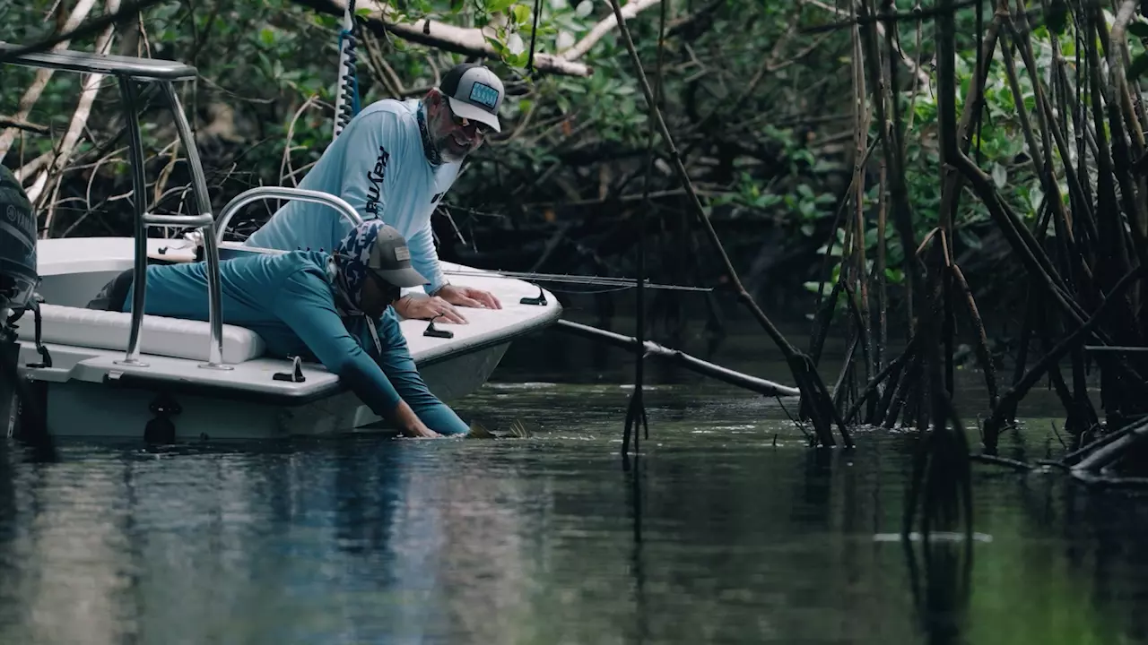 C.A. Richardson releasing a fish