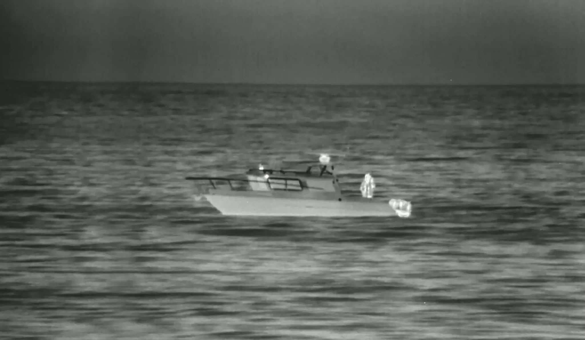 FLIR Thermal vision of a boat at sea.